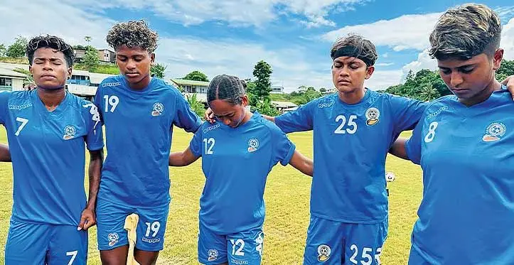 Team Fiji women's football's Louisa Simmons {third from left) prays with her team-mates after training at Naha school ground in Honiara, Solomon Islands, on November 19, 2023. Photo: Waisea Nasokia