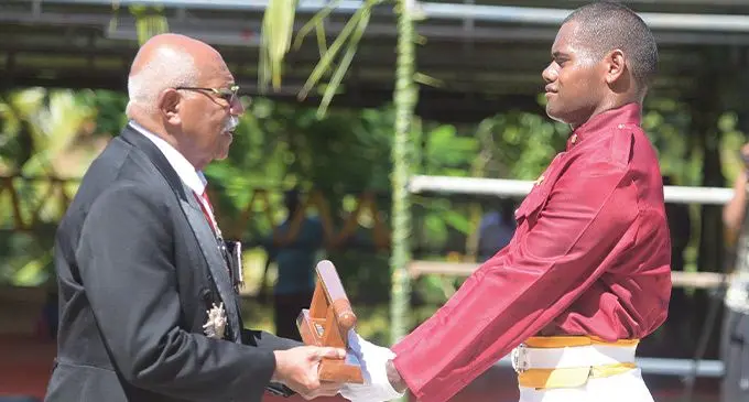 Prime Minister Sitiveni Rabuka awads boton of honor to Iokimi Dia during Fiji Corrections Service passing out parade at the Naboro Corrections facility on March 24, 2023. Photo: Ronald Kumar
