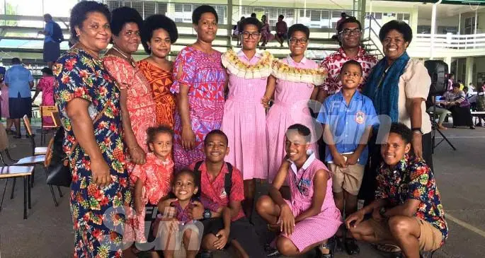 The twins Emali Bukalidi (left) and Miriama Bukalidi with their family members. Photo: Renu Radhika.