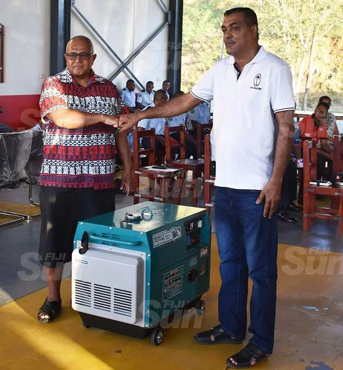 National Fire Authority chief executive officer Puamau Sowane (left) receives the generator from Lautoka Auto Mechanical and Air Con Services managing director, Arvin Chand. Photos: Waisea Nasokia