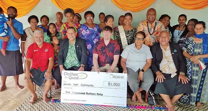 Middle Clothes For Good founder Hayden Ostrom (seated third from left), Nasinu Town Council executive chairman Felix Magnus (second from left), with members of the Nasole HART Community.