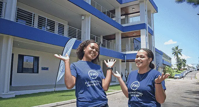 Fiji National University’s College of Business, Hospitality and Tourism Studies (CBHTS) students, Kesaia Cavuilati and Maria Rosi celebrate the opening of their college building at Nasinu Campus on October 28, 2022. Photo: Ronald Kumar