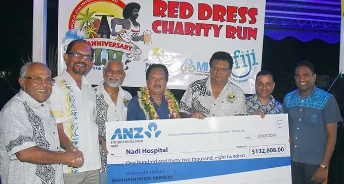 Hash grandmaster Dr Ram Raju (left) hands over the cheque to the Chairman of the Nadi Hospital Board of Visitors Mohammed Israr khan (second from left) at Martintar Hotel in Nadi on July 27, 2019. Photo: Waisea Nasokia