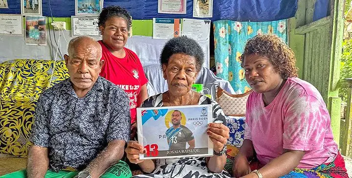 Couple Tevita and Mereani Raisuqe, with family members and a photo of former Fiji 7s rep Josaia Raisuqe, who was killed in an road accident in France this week. Photo: Inoke Rabonu