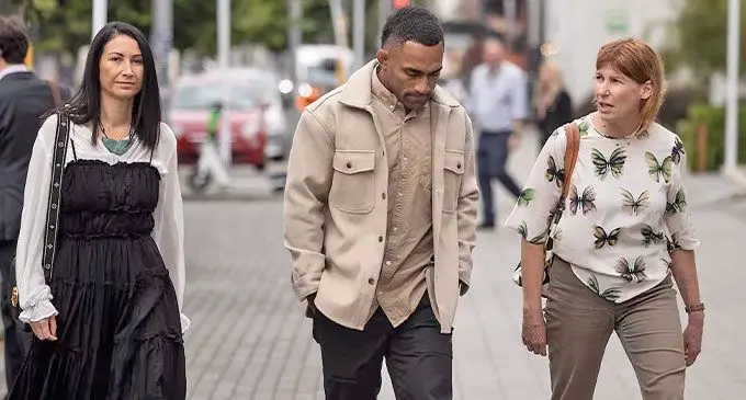 Fiji born All Black winger Sevu Reece with his partner (left) on their way to the Christchurch District Court for his sentencing on December 3, 2024. Photo: George Heard/New Zealand Herald.