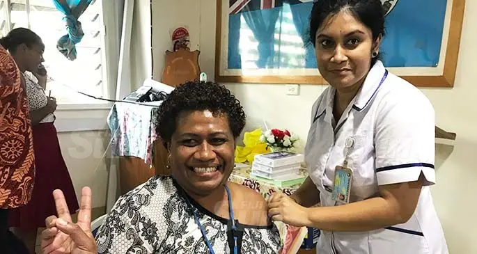 Labasa Hospital laboratory supervisor Makarita Baleinadogo gets vaccinated by staff nurse Meenal Devi at the Labasa Hospital conference room on March 11, 2021. Photo: Laisa Lui