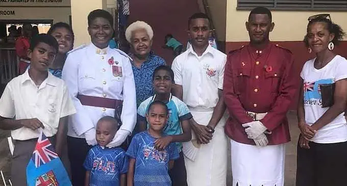 (Second from left) RFMF Nadi Delta Company Second in Command Captain Loraini Navunicagi with her family and a Fiji Corrections Services officer (fifth from left) in Lautoka.