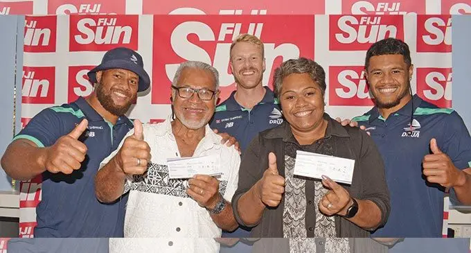Fiji Sun Swire Shipping Fijian Drua and Highlanders match ticket promotion winners (standing front from left) Sonny Kenny and Cema Tawai, with Fijian Drua reps Jone Koroiduadua (back left), Baden Kerr and Zuriel Togiatama at the Fiji Sun office on April 27, 2022. Photo: Ronald Kumar.