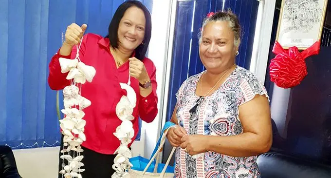 Minister for Education Rosy Akbar (left) with a Navua resident whom she traded with.