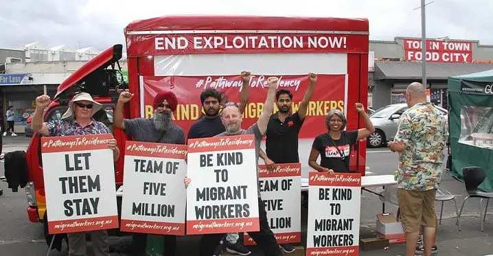 Anu Kaloti, right, from the Migrant Workers Association with migrant workers during a rally in New Zealand in 2021. Photo: RNZ Pacific