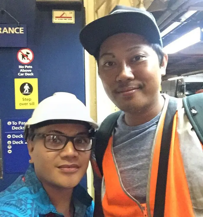 Sokimi Kautane (left) with a Filipino colleague.