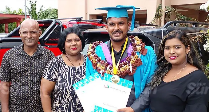 Neekith Neel Prasad is flanked by his parents Aneel Prasad and Prema Prasad and sister Neetashna Prasad on December 17, 2021. Photo: Salote Qalubau