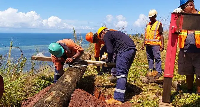 Working to restore power in Nabouwalu.  Photo: Joe R