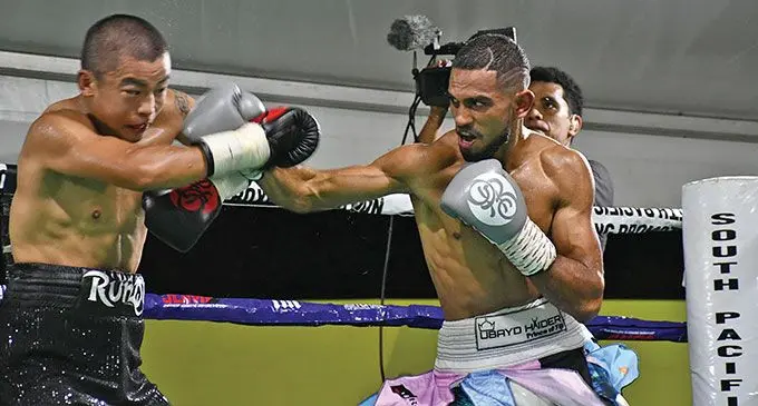Runqi Zhou (left) blocks a jab from Umbayd Haider during their IBO Asia Pacific featherweight title fight at Prince Charles Park, Nadi, on October 26, 2024. Photo: Waisea Nasokia
