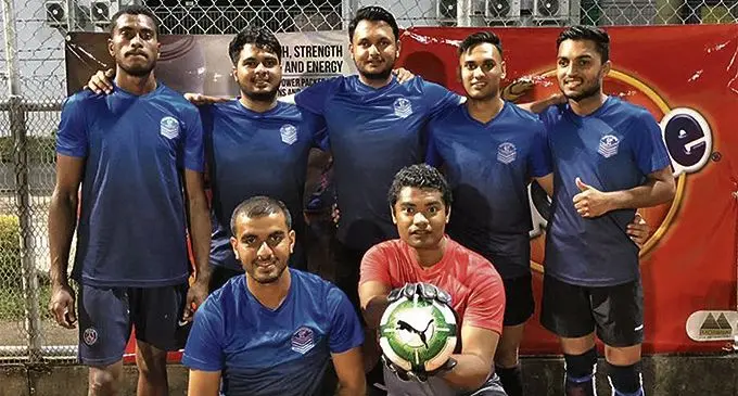 Team Evergreen International in a jovial mood after winning their first pool match in the Ovaltine Suva Business House Futsal Soccer League (1) copy