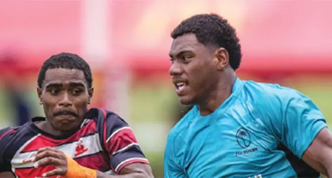 Sivaniolo Lumelume (right) on the attack for Fiji Under-20 in last year’s MacDonalds Fiji Coral Coast tournament. Photo: Leon Lord