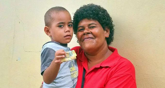 Anaseini Ca with youngest son Apimeleki Drasa after receiving the inflation mitigation  assistance in Ba on September 1, 2022. Photo: Salote Qalubau