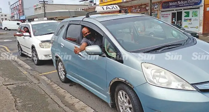 Vakabale Street taxi drivers ( front)Sharif Mohammed and Kamlesh Chandra in Lautoka City on February 7, 2022.  Photo: Salote Qalubau