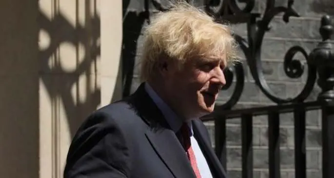 British Prime Minister Boris Johnson leaves 10 Downing Street for Prime Minister's Questions in London, Britain, May 20, 2020. (Photo by Tim Ireland/Xinhua)