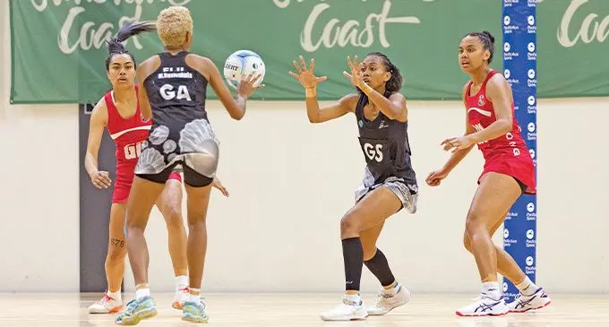 Fiji Pearls goal attack Maliana Rusivakula (left) flips a pass to goal shooter Unaisi Rauluni during their match against Tonga Tala in the PacificAus Sports series at USC Stadium, Queensland, Australia on October 16, 2022. Photo: Netball Australia.