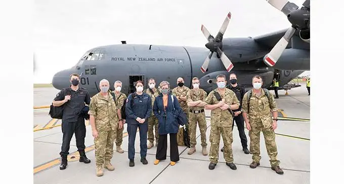 Masked up and ready to go! Members of the combined training team, pictured at Royal New Zealand Air Force Base Auckland prior to departure. 