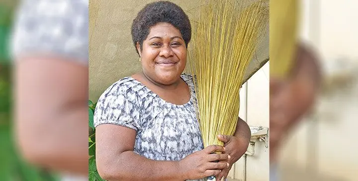 Alisi Tokalau with brooms to be sold in Labasa Town. Photo: Shratika Naidu