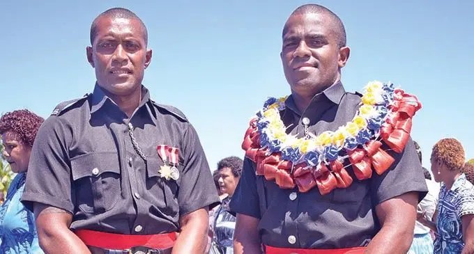 Olympians (from left)  Samisoni Viriviri and Kitione Taliga  following their Police  basic recruit passout at the Nasova Police Academy in Suva on September 11, 2020.  Photo: Ronald Kumar