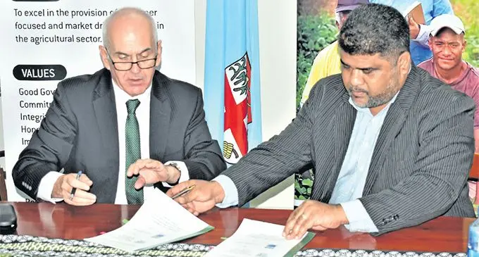 From left: Fiji Development Bank chief executive officer Mark Clough and Permanent Secretary for Agriculture David Kolitagane during the signing of the Memorandum of Understanding at the Ministry of Agriculture headquarters in Suva on April 8, 2019. Photo: Ministry of Agriculture