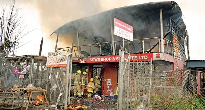 Firefighters at Sita’s Shop & Save shop in Nakasi Rd on December 1, 2021.  Photo: Ronald Kumar