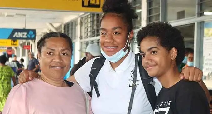 Rooster Chicken Fijiana XV player Sulita Waisega with family members at Nausori International Airport on July 18, 2022. Photo: FRU Media 