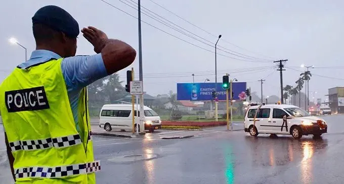 Ni Sa Moce Mada Laisenia Qarase..... A Police officer salutes the funeral cortege of Laisenia Qarase at the Samabula junction in Suva as it made its way to the Nausori International Airport on April 29, 2020. The former Prime Minister was laid to rest on his island in Vanuabalavu. Photo: Police Media Cell