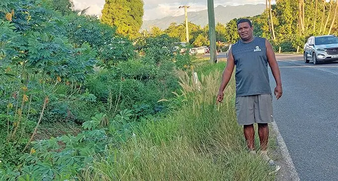 Atunaisa Tuira points at the spot where his niece landed after the accident along the Queens Road near Matawalu Village in Lautoka on June 23, 2023. Photo: Salote Qalubau