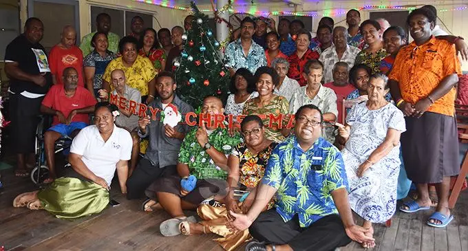 Minister for Women, Children and Poverty Alleviation Mereseini Vuniwaqa (standing third from right), staff and residents of the Golden Age Home during their thanksgiving dinner at the home on December 13, 2019. Photo: Laisa Lui.