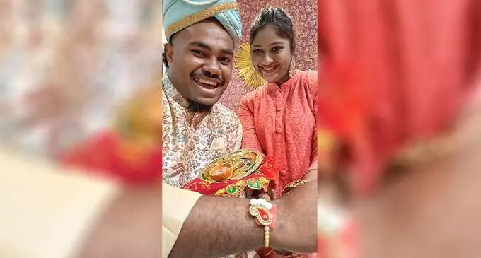 Be my brother ... Praveena Devi ties the  Raksha Bandhan (protection thread) to workmate  Joshua Dinati as they marked Raksha Bandhan at  their workplace on August 11, 2022. Photo: Ronald Kumar