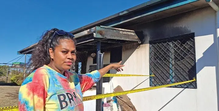 Kelera Bosevakaturaga pointing to the front flat that was destroyed by fire. Photo: Mereleki Nai