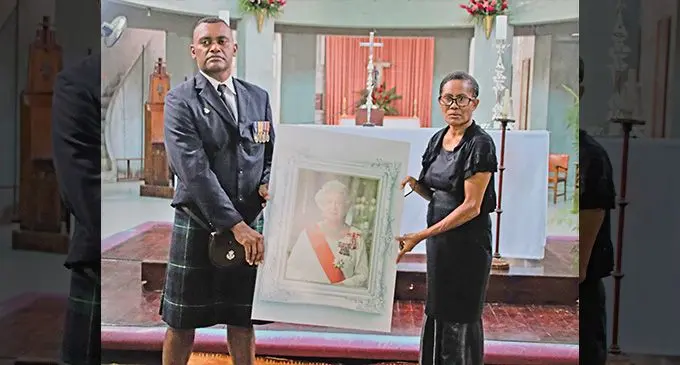 Former British Army corporal Esala Vukitoga and wife Sera Silimaibau during the memorial service for the late Queen Elizabeth II at the Holy Trinity Anglican Church in Suva on September 16.