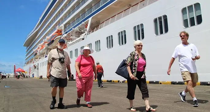 Cruise tourists disembark at the Port of Suva.