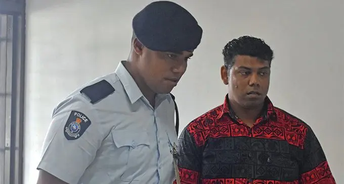 Pranil Prakash Sen being escorted by Police. Photo: Nicolette Chambers