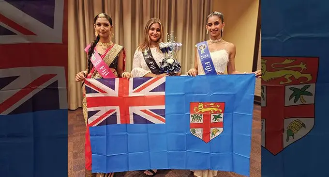 From left: Shreha Singh, Akansha Narayan and Nazeela Ali with a Fiji flag at the Miss/Mrs/Teen India Worldwide pageant in June this year.