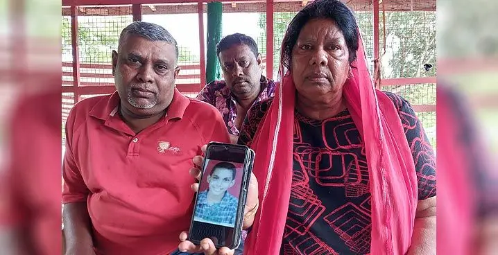 From left: Gafoor Samat with his brother, Bashir (middle) and mother, Jinath Nisha holding a photo of the late, Hassan Nafiz Samat at their residence at Tagaloli Road in Teidamu, Lautoka on January 25, 2023. Photo: Nicolette Chambers