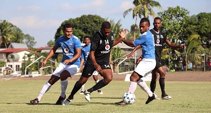 Ba football striker Samuela Drudru dribbles past Rewa defenders Penioni Drova and Kavaia Rawaqa while his team-mate Sanaila Waqanicakau looks on during the second round of the Vodafone Premier League at Fiji FA Academy ground in Ba on August 29,2020. Rewa came from behind to snatch a 1-1 draw and keep their spot at the top of the points table. Photo: Fiji FA Media 