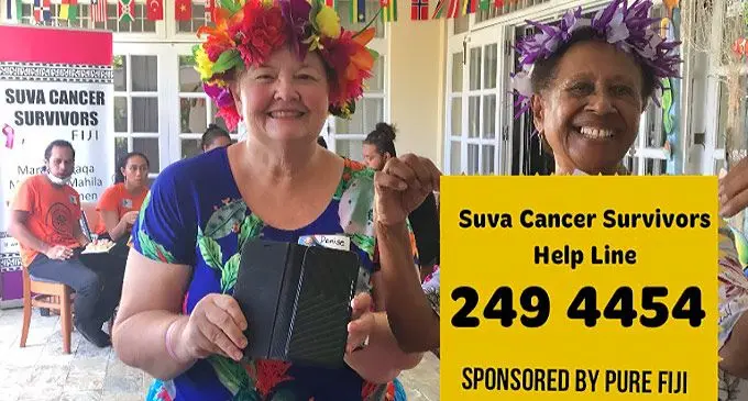 President Salote Qalo (right) and Denise Kloeden release the help line number on International Women’s Day on March 8, 2022. Photo: Suva Cancer Survivors Group