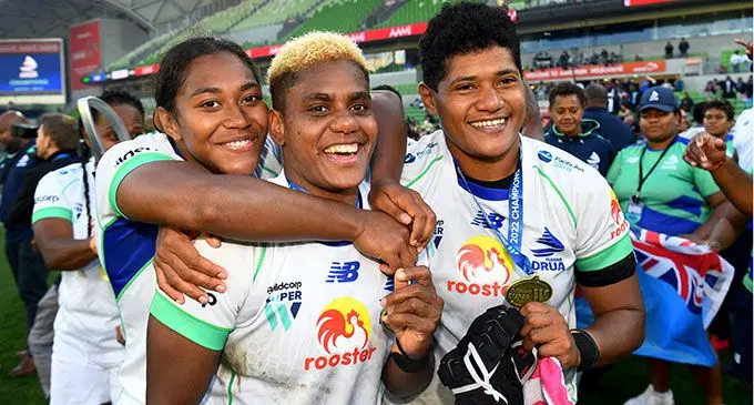 From left: Rooster Chicken Fijiana Drua reps Raijieli Laqeretabua, Roela Radiniyavuni and Joma Rubuti celebrate their Super W title victory in Melbourne after beating Waratahs 32-26 in the final. Photo: William West / AFP