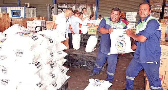 FMF staff members with 10,000 packs of food ration on December 19, 2020 ready to be donated to those affected by Cyclone Yasa in Vanua Levu.  Photo: Ronald Kumar