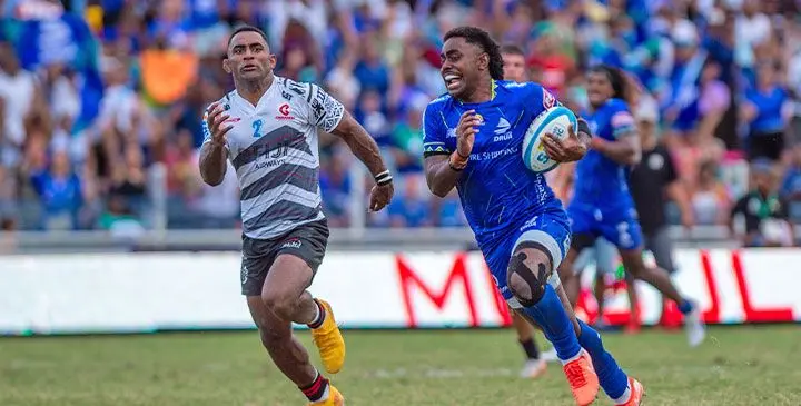 Fijian Drua utility back Isikeli Rabitu runs away from Crusaders centre Sevu Reece to score a try in their Shop N Save Super Rugby clash at Suva's HFC Bank Stadium on April 5, 2025. Photo: Leon Lord