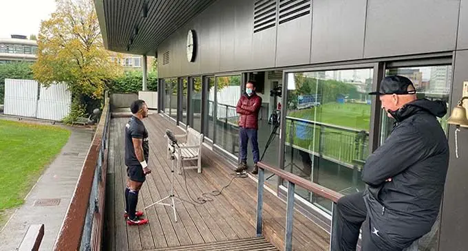 COVID-19 way in London... Barbarians squad member Serupepeli Vularika (left) being interviewed by the media in London, while Barbarians and Flying Fijians head coach Vern Cotter (right) looks on. Photo: Barbarians