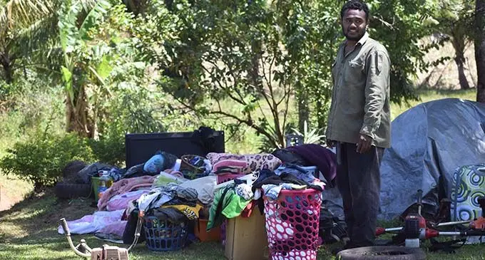  Adrea Bulavakarua took all their belongings outside during the fire at Qelewaqa in Labasa yesterday .   Photo:  Mohammed Zulfikar.