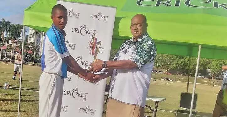 The captain of the Queen Victoria School cricket team receives their reward for claiming the Southern Zone Under-19 Cricket championship on July 6, 2023. Photo: Cricket Fiji