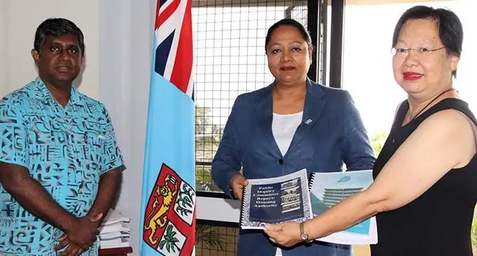 Minister for Housing and Community Development Premila Kumar receiving the two Reports from HA Board Chair, Lorraine Seeto.