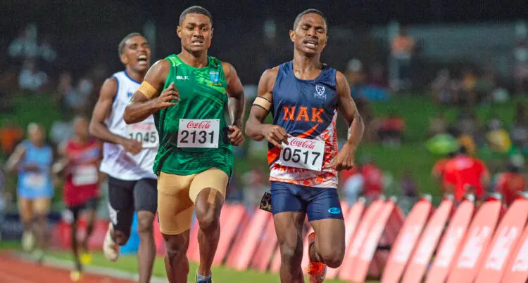 A photo of Veresa Valemei running ahead of two competitors.